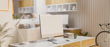 Home working space with computer desk, supplies, furniture and bicycle in the room, 3D rendering, 3D illustrationの写真素材