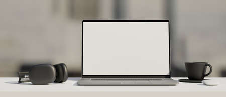 Black and white workspace with mock-up laptop, headphones and cup, 3D rendering, 3D illustrationの写真素材