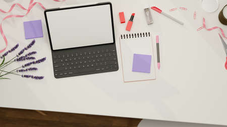 Top view of digital tablet with mock-up screen and keyboard on feminine workspace, 3D rendering, 3D illustrationの写真素材
