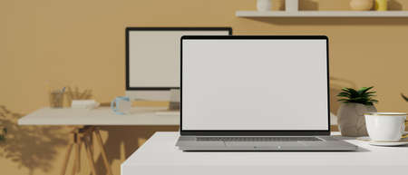 Laptop with mock-up screen on the desk and computer table in the background, 3D rendering, 3D illustrationの写真素材