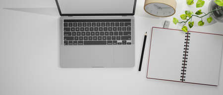 Top view of workspace with laptop, stationery and decorations, 3D rendering, 3D illustrationの写真素材