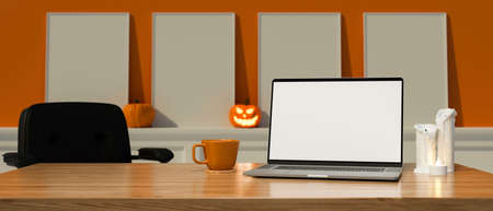 Laptop with mock-up screen on the table in the room decorated with halloween decorations, 3D rendering, 3D illustrationの写真素材