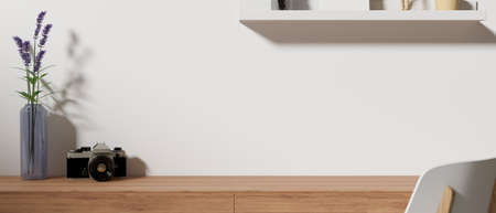 Home office working space with camera, flower vase, shelf and copy space on the table, 3D rendering, 3D illustrationの写真素材