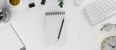 Blank notebook on white desk with stationery and supplies, 3D rendering, 3D illustration, top viewの写真素材