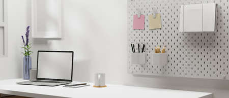 Minimal workspace with laptop, stationery and decoration in home office room, 3D rendering, 3D illustrationの写真素材