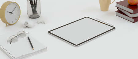 Digital tablet with mock-up screen on study table with stationeryの写真素材