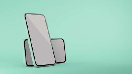 Two smartphone with mock-up screen isolated on mint green background with copy space, 3D rendering, 3D illustrationの写真素材