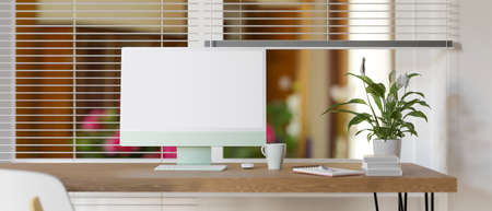 Computer desk with plant pot and stationery beside the window, 3D rendering, 3D illustrationの写真素材