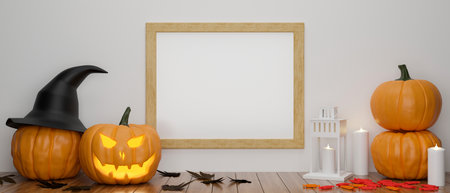 Mock-up frames on the wall with the table decorated with pumpkin lamps and stuff in halloween conceptの写真素材