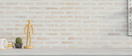 Mock-up workspace with decorations, copy space and brick wall background, 3D rendering, 3D illustrationの写真素材