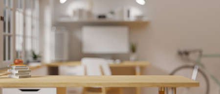 Wooden table with stack of books and copy space in blurred home office background, 3D rendering, 3D illustrationの写真素材