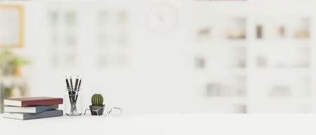 Table with stationery, office supplies and copy space with blurred office background, 3D rendering, 3D illustrationの写真素材