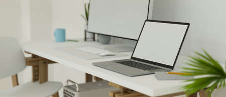 Workspace with laptop, stationery on the desk and shelf on loft wall, copy space, 3D rendering, 3D illustrationの写真素材