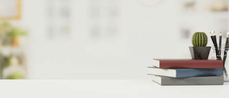 White wooden table with copy space, blurred background with books and office supplies,3D rendering, 3D illustrationの写真素材
