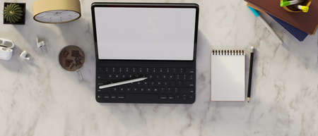 Top view of laptop blank screen with note pads, pen, coffee, clock, headphone and office supplies on the white marble desk 3D, 3D illustrationの写真素材