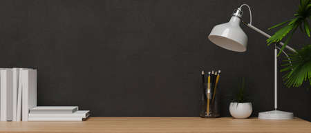 Modern interior style, Copy space for product display on wooden table with table lamp, plants, pencils, books and black wallpaper 3d rendering, 3d illustrationの写真素材
