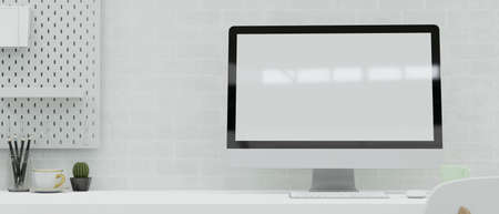 Modern workspace with computer, stationery, and decorations on the desk in white brick wall room, 3D rendering, 3D illustrationの写真素材