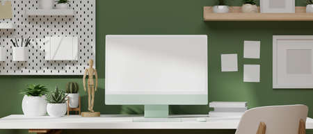 3D rendering, 3D illustration modern work space with computer monitor on the white desk with office supplies, modern office decoration and green wallpaperの写真素材