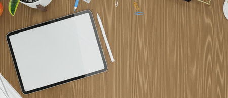 Tablet empty screen mock up with copy space for product display and work space decor stuff on wooden...