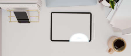 Modern style work space, Empty screen tablet mock up with coffee cup, mobile phone and decor on white desk, 3d rendering, 3d illustrationの写真素材