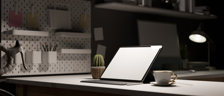 Work space in apartment at night, tablet empty screen on white table, decor with cactus, coffee cup and stationery shelf, office in evening, 3d rendering, 3d illustrationの写真素材