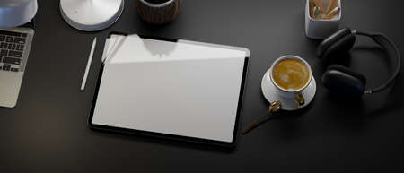 Top view, Creative black workspace, tablet mockup, coffee, laptop, headphone, stationery, black table background, 3d rendering, 3d illustrationの写真素材