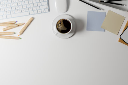 Top view office work table, copy space for text advertising on white background, keyboard computer, coffee, accessories, modern style, 3d rendering, 3d illustrationの写真素材