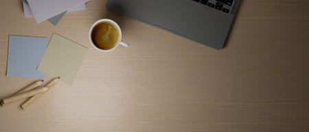 Top view, wood computer desk with grey laptop, coffee, sticky notes, colour pencils, copy space for your works, 3d rendering, 3d illustrationの写真素材