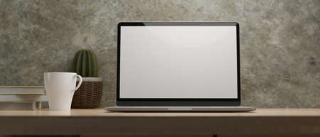 Laptop display for mockup on wood table at home office with coffee, cactus, books, concrete wall, room under light, 3d rendering, 3d illustrationの写真素材