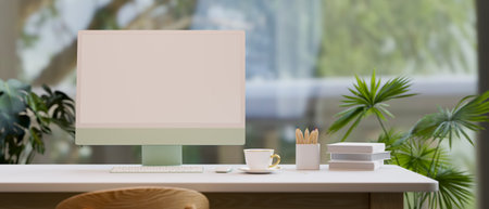 Workspace with natural greenery view outdoor through wide window, desktop computer mockup, coffee, books, pencils on work table, 3d rendering, 3d illustrationの写真素材