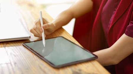 Online teacher using stylus pen to taking lecture and list the topic for teach her student, online...
