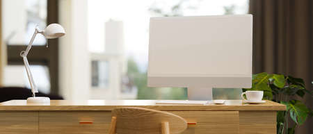 Scandi style home working place with desktop computer mockup, table lamp on wood table, house plant near window, 3d rendering, 3d illustrationの写真素材