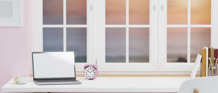 Workspace with laptop blank screen mockup and copy space on white table near window with colourful sky view, coffee cup, alarm clock, books, frame, pink wallpaper, 3d rendering, 3d illustrationの写真素材