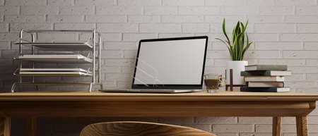 Simple home working desk in modern room interior, opened laptop, office supplies, decorations on wooden desk, white brick wall, 3d rendering, 3d illustrationの写真素材