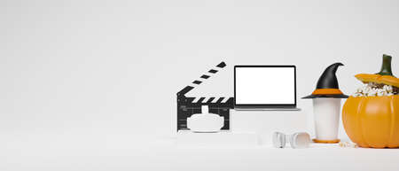 VR goggles, headphone, laptop blank screen mockup on podium with popcorn bucket, witch hat, movie clapper on white background, 3d rendering, 3d illustrationの写真素材
