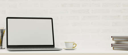 Close up modern workspace with opened laptop screen mockup, copy space on white table, white brick wall, 3d rendering, 3d illustrationの写真素材