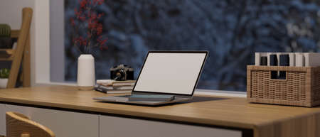Modern home working space with big window, Laptop computer blank screen mockup on wooden desk, 3d rendering, 3d illustrationの写真素材