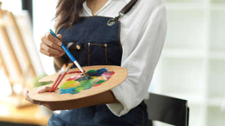 Artist palette closeup, female artist mixed oil colour on art palette, creative art, inspiration painterの写真素材