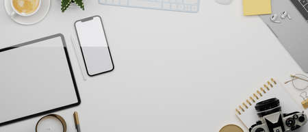 Mockup space on white background surrounded by tablet, smartphone, laptop, keyboard, camera and decorations, flat lay, top view, modern digital background, 3d rendering, 3d illustrationの写真素材