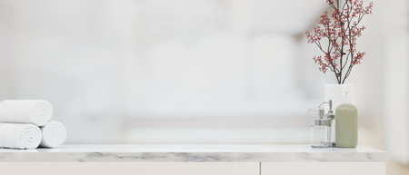 Empty space on marble counter top with ceramic shampoo or soap bottle, skincare pump bottles and towels in blurred bright bathroom background, 3d rendering, 3d illustrationの写真素材