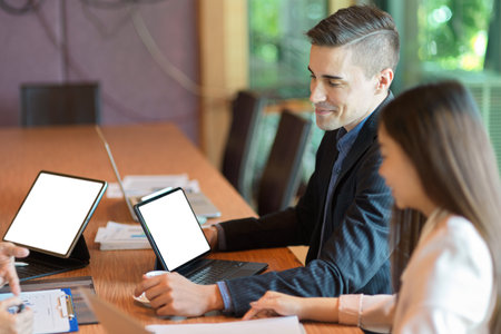 Business people planning and brainstorming business financial in meeting room at office. diverse businesspeople, tablet computer screen mockupの写真素材