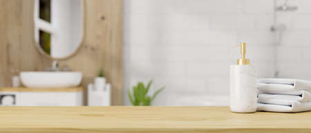 Wooden table top or wooden board with ceramic shampoo bottle and towels over contemporary Scandinavian wooden bathroom interior background. 3d rendering, 3d illustrationの写真素材