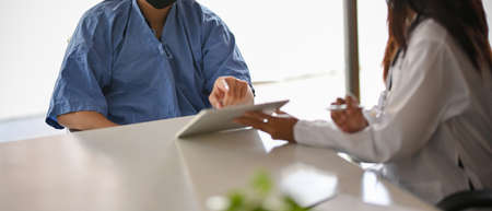 Cropped image of Patient consulting and follow up his symptoms with specialist psychologist or physician at hospitalの写真素材