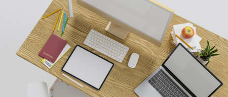 Top view of wooden computer desk with computer, tablet and laptop blank screen mockup, passport,...