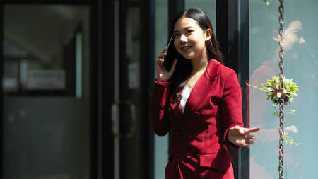 Good business talk concept. a Professional business women talking and discussing on the phone at the officeの写真素材
