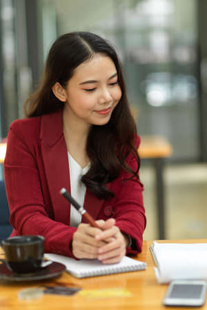 Pleased businesswoman satisfied with the work of her assistant. Business executive happy with business performance in the meetingの写真素材
