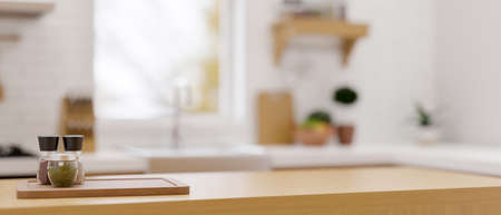 Modern wooden counter top for montage with set of seasoning shakers over blurred modern kitchen background. 3d rendering, 3d illustrationの写真素材
