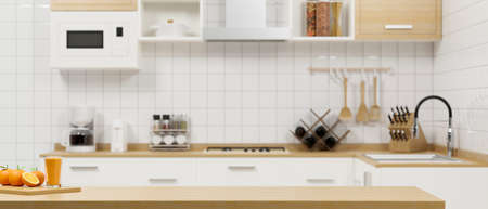 Minimalist kitchen space interior in the background with close-up wooden dining tabletop with oranges, a glass of orange juice and space for montage product display. 3d rendering, 3d illustrationの写真素材