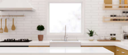 Modern empty white table top or kitchen island for montage product display on blurry Scandinavian kitchen room interior background. 3d rendering, 3d illustrationの写真素材