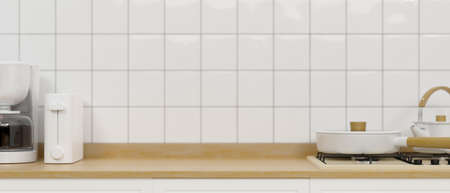 Minimalist Japanese kitchen interior style with wooden counter, stove, toaster, coffee machine and space for montage on white brick wall. 3d rendering, 3d illustrationの写真素材